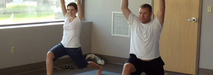 A man and a woman in a yoga pose
